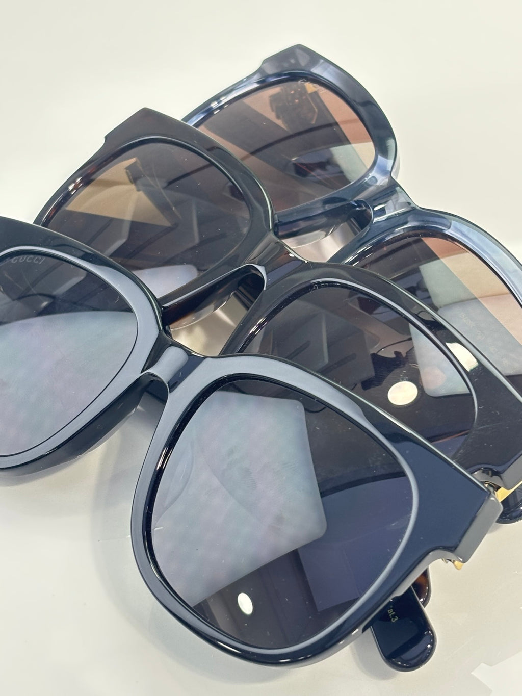 Gucci sunglasses with overlapping round lenses and dark blue glossy frame