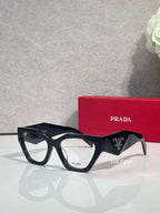 Black rectangular eyeglasses with clear lenses and tortoiseshell accents, Prada branding