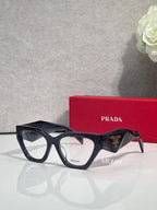 Black rectangular eyeglasses with clear lenses and tortoiseshell arms, Prada branding