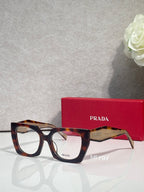 Square tortoise eyeglasses with clear bridge and Prada logo on the temple