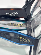 Prada Milano eyeglass temples with blue and clear striped acetate bands