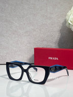 Square navy eyeglasses with blue temple accents and Prada logo on lens