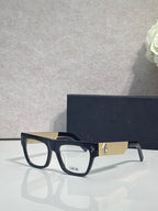 Dior eyeglasses with black square frames and gold textured temple detail