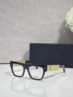 Dior eyeglasses with dark square frames and gold textured temple detail