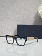 Dior eyeglasses with black square frames and gold textured temple detail