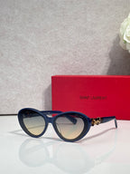 Navy round eyeglasses with gold temple logo and gray lenses