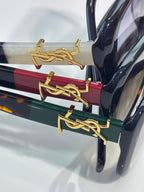 YSL sunglasses temple with gold logo hardware on dark frames