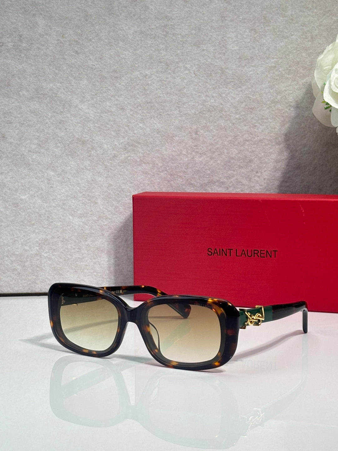 YSL rectangular sunglasses with dark tortoiseshell frames and pale tinted lenses