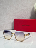 YSL glasses with light gold frame and smoky purple tinted lenses, cat-eye