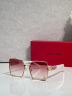 Square sunglasses with pink gradient lenses, gold frame and YSL logo hardware