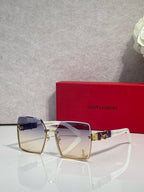 Square sunglasses with navy gradient lenses, gold frame and YSL logo hardware