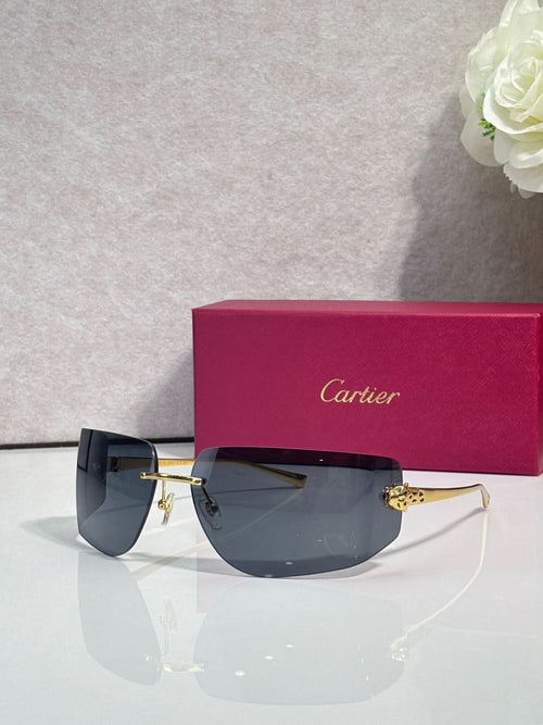Cartier sunglasses with dark blue gradient lenses and gold-tone metal frame