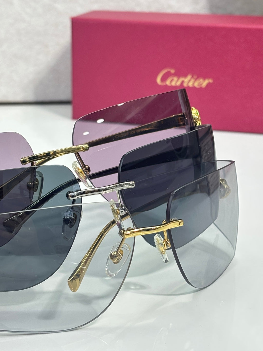 Cartier sunglasses with purple top lens tint and dark frame details