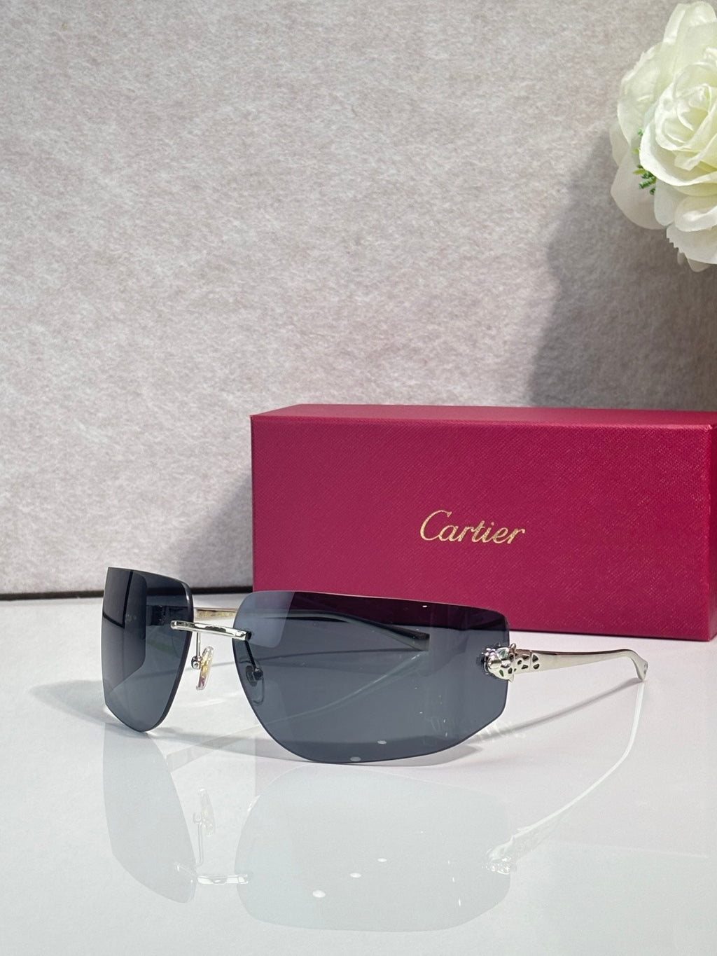 Cartier sunglasses with dark blue gradient lenses and gold-tone metal frame