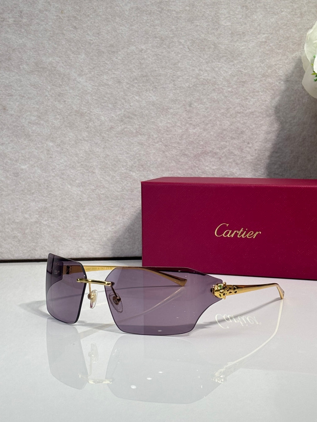 Cartier oversized square sunglasses with dark lenses and gold-tone frame