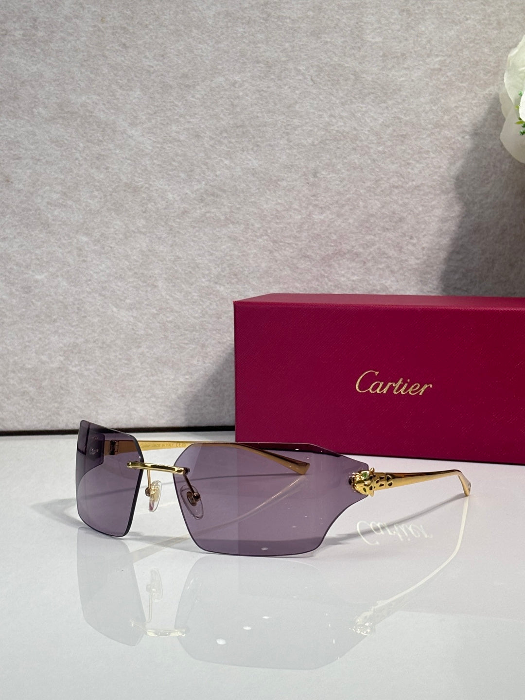 Cartier oversized square sunglasses with dark lenses and gold-tone frame