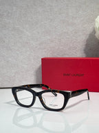Black and tortoise acetate eyeglasses with clear lenses and gold-tone hinge hardware