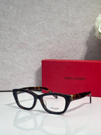 Black and tortoise eyeglasses with clear lenses and gold-tone hinges