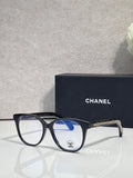 Chanel eyeglasses with dark blue round frames and blue-tinted lenses