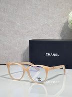 Chanel eyeglasses with cream round frames and clear lenses