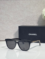 Chanel glasses with black frames and smoky gray lenses