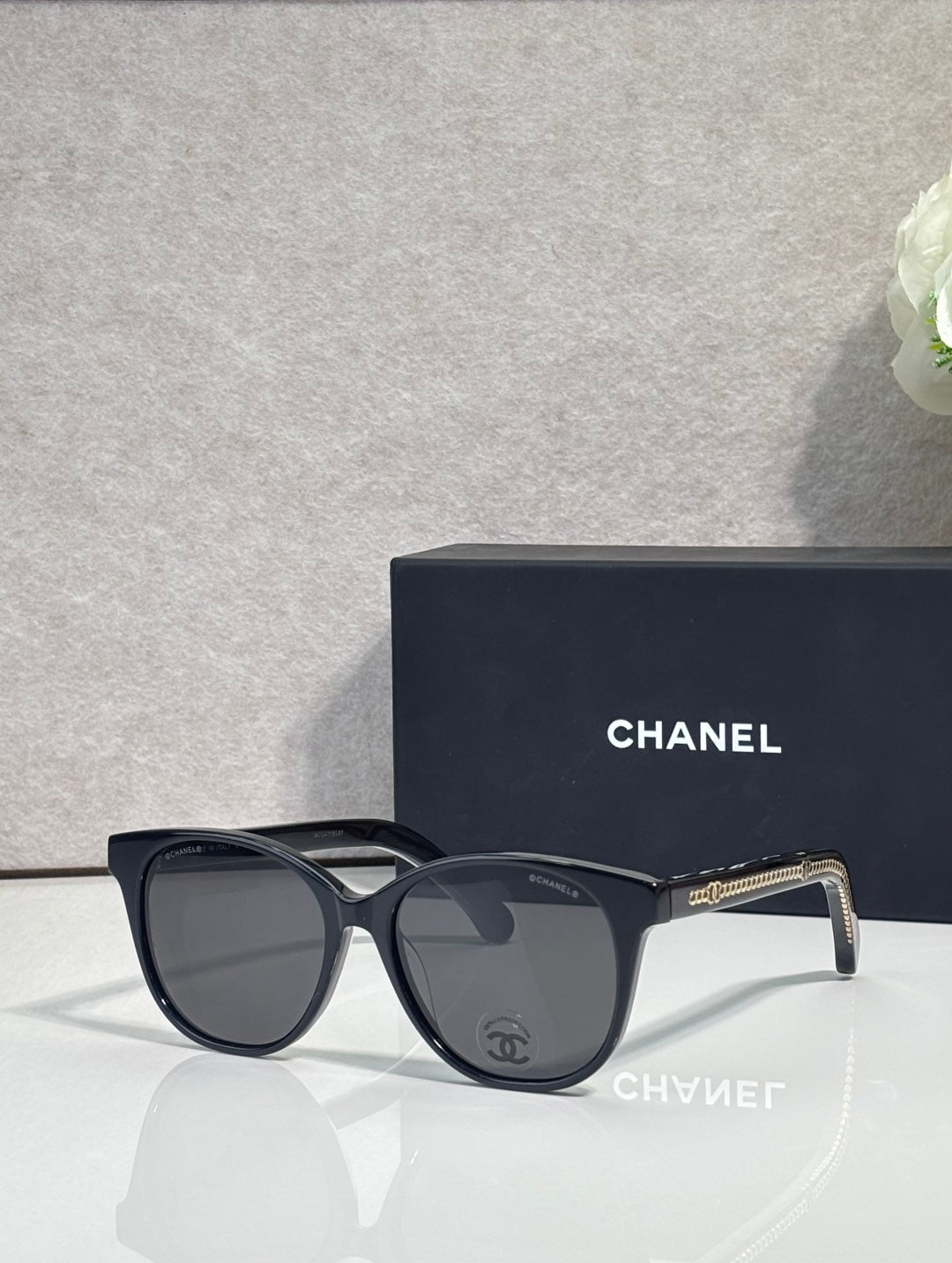 Chanel glasses with black frames and smoky gray lenses