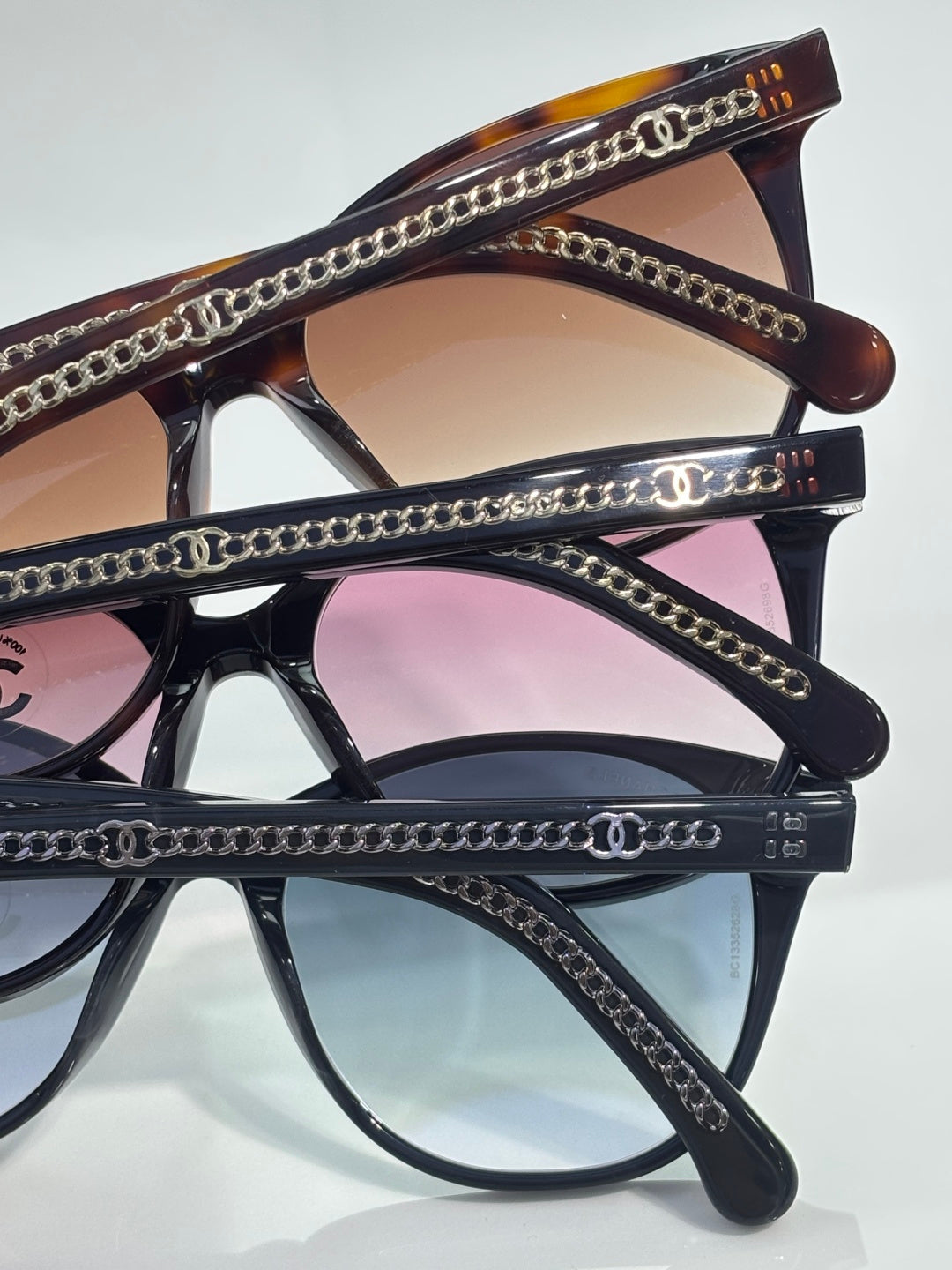 Chanel glasses with dark frames, round lenses, and chain-detailed temples