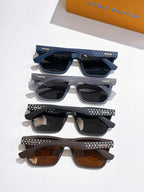 Louis Vuitton sunglasses set of four pairs, stacked with patterned temples and colored lenses.