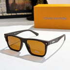 Louis Vuitton sunglasses with amber lenses and dark frames, patterned temple detail.