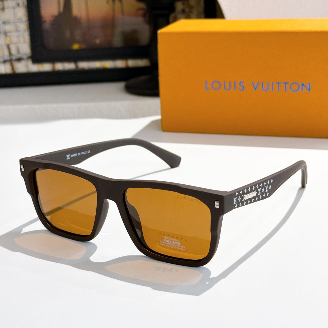 Louis Vuitton sunglasses with amber lenses and dark frames, patterned temple detail.