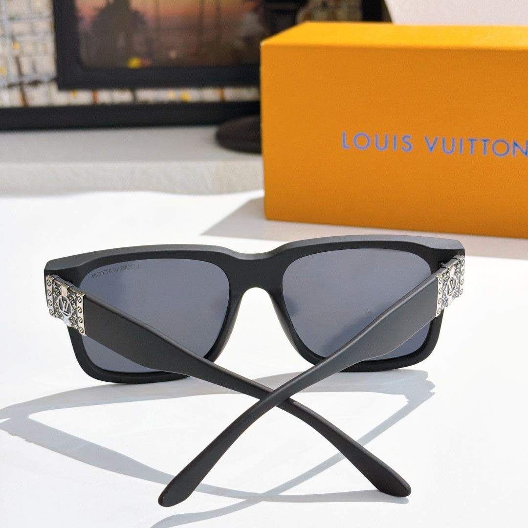 Louis Vuitton sunglasses front view with black frame, dark lenses, patterned side panels.