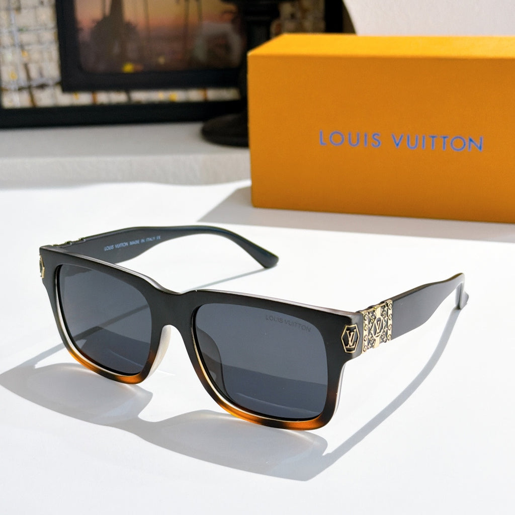 Louis Vuitton sunglasses with black frame, dark lenses, and patterned temples with gold trim.