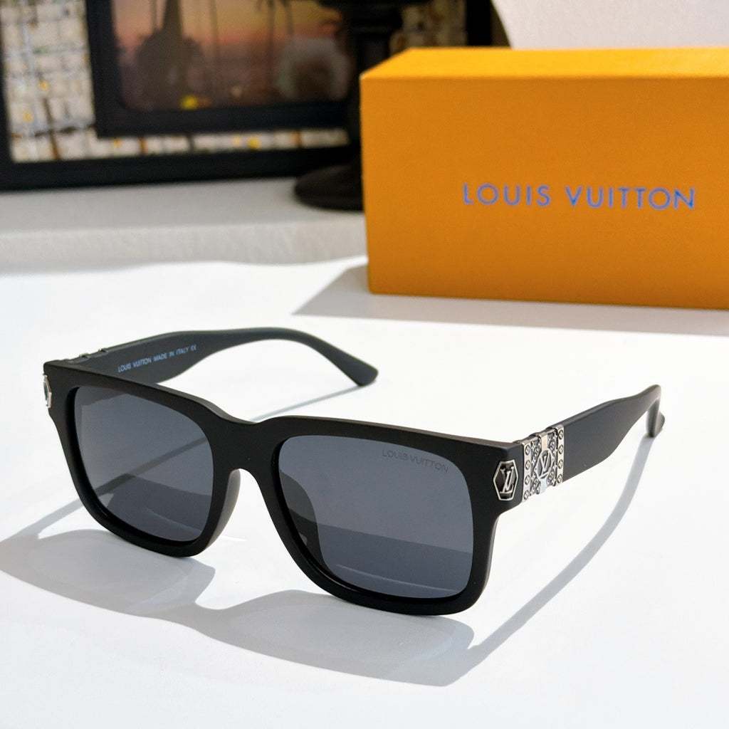 Louis Vuitton sunglasses with black frame and dark lenses; patterned temple inserts.