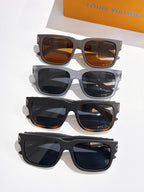 Four pairs of Louis Vuitton sunglasses with patterned temple bands and mixed lens tints.