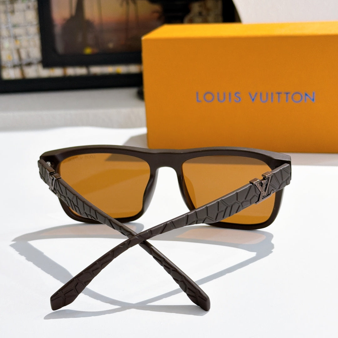 Louis Vuitton sunglasses front view with dark frame, amber lenses, and textured patterned arms