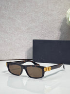Dior black-and-tortoiseshell rectangular sunglasses with dark lenses and gold logo hinge