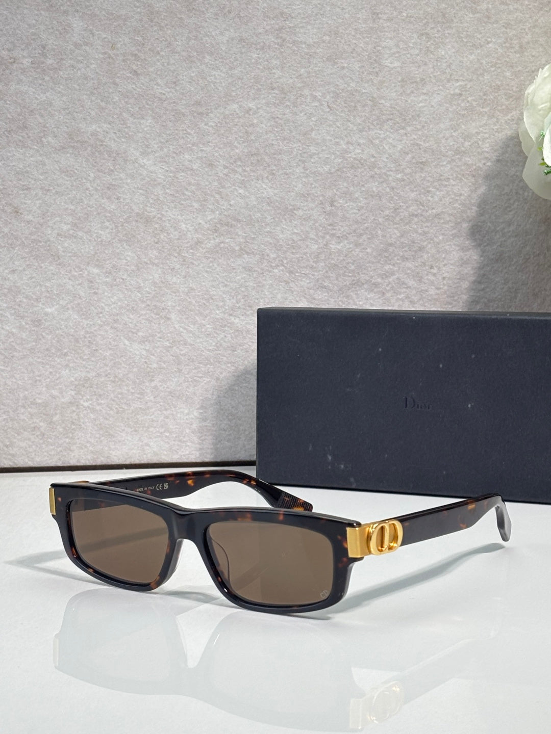 Dior black-and-tortoiseshell rectangular sunglasses with dark lenses and gold logo hinge