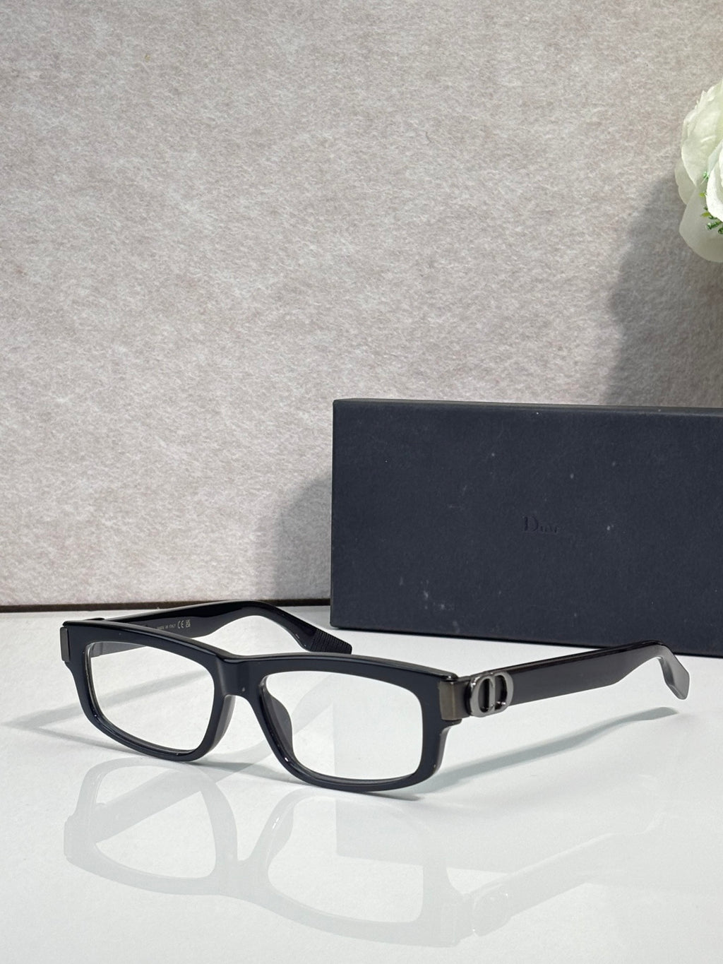 Dior black rectangular eyeglasses with clear lenses and metal hinge detailing