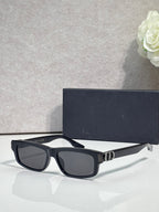 Dior black rectangular sunglasses with dark lenses and metal logo hinge