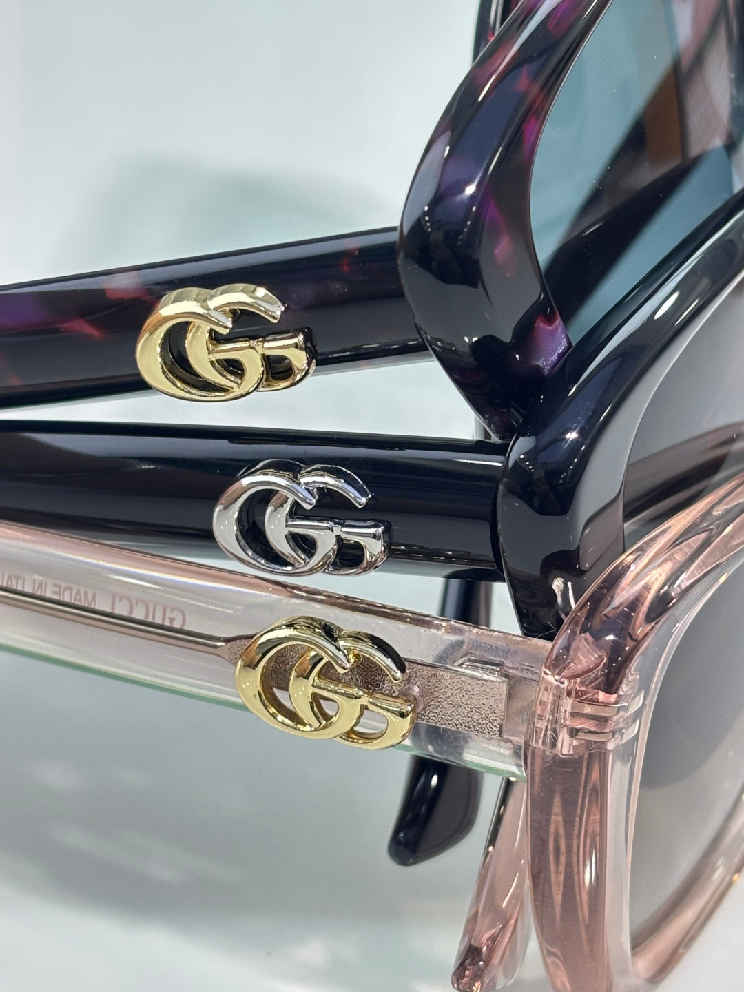 Designer glasses temples with gold and silver GG emblem hardware