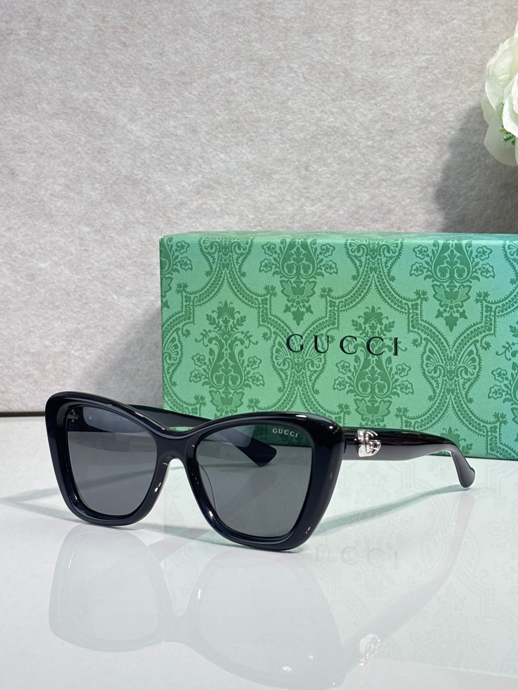 Designer eyeglasses with black frames and tinted lenses