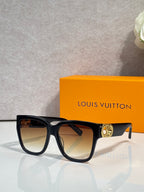 Sunglasses with dark tortoiseshell frame, tan-tinted lenses, and gold LV emblem on temple