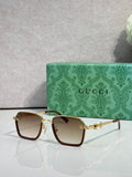 Gucci sunglasses with dark brown square frames and warm brown gradient lenses
