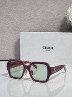 Maroon rectangular sunglasses with light green-tinted lenses and gold logo on the temple