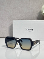 Black rectangular sunglasses with gradient lenses and gold logo detail on the temple