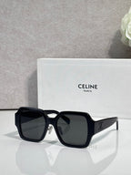 Black rectangular sunglasses with dark lenses and gold logo on the side temple