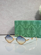 Gucci sunglasses with light brown lenses and gold metal frames, arched square style