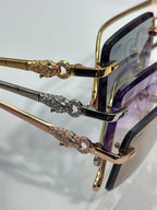 Cartier eyeglasses close-up: gold frame with jeweled bridge detail