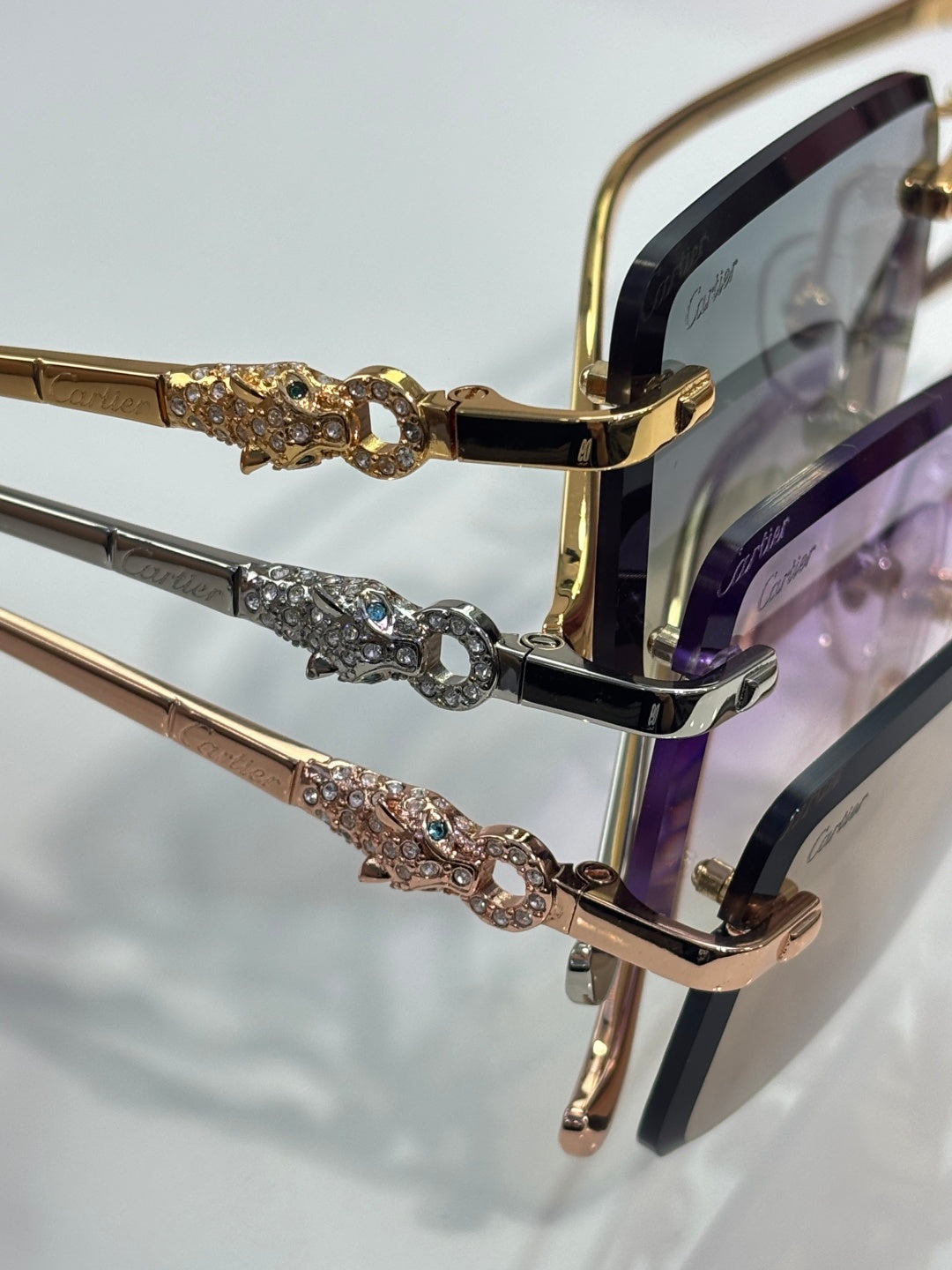 Cartier eyeglasses close-up: gold frame with jeweled bridge detail