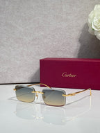Cartier glasses with gold frame and muted blue gradient lenses, square silhouette